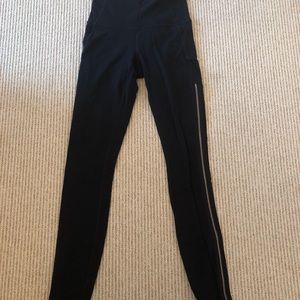 Athleta black leggings with gold zipper